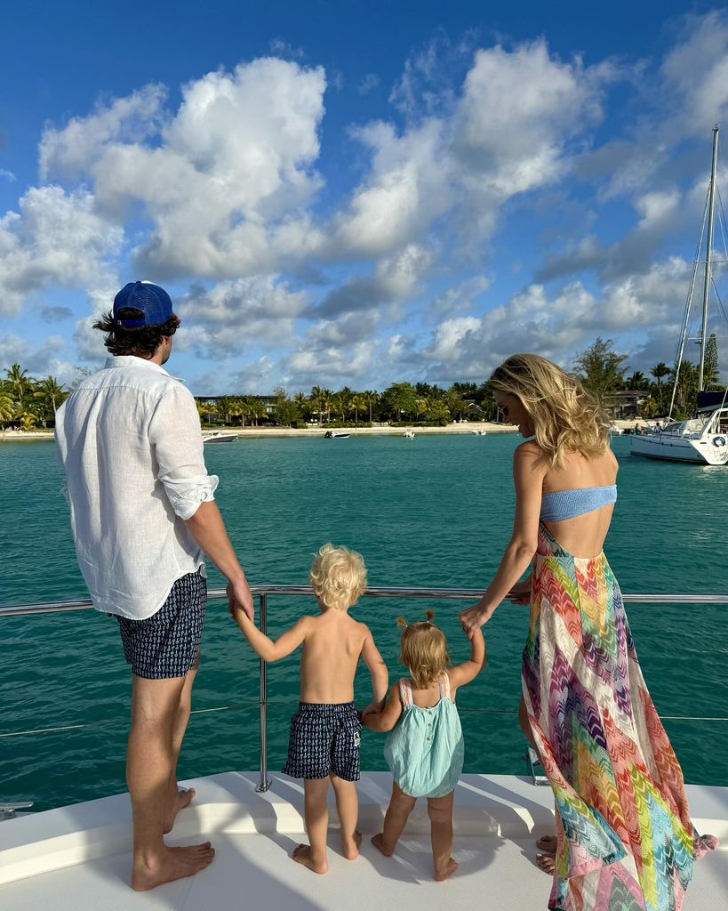 Chelsy Davy with her husband, Sam, and children Leo and Chloe at the beach in the sun 