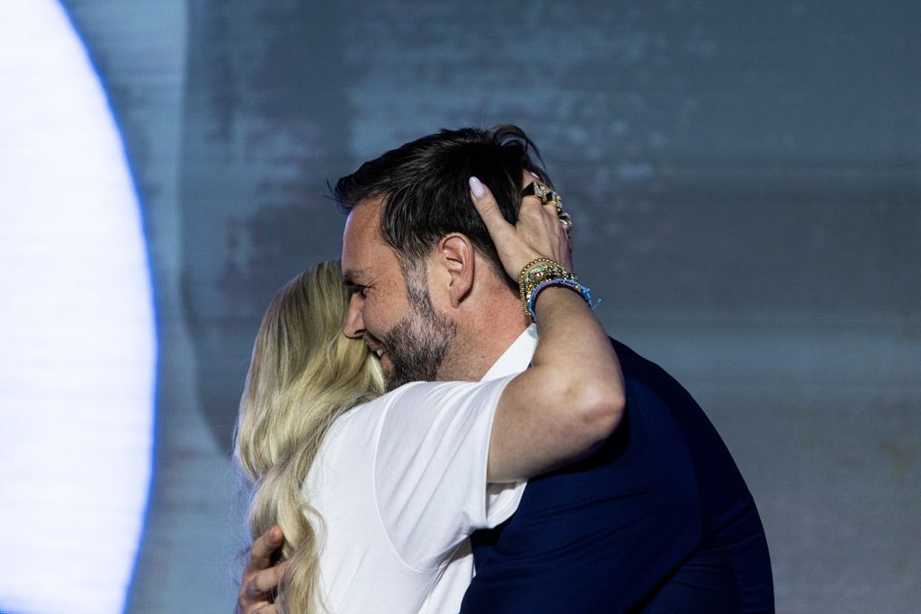Erika Kirk and U.S. Vice President JD Vance embrace at the Pavilion at Ole Miss on the campus of the University of Mississippi