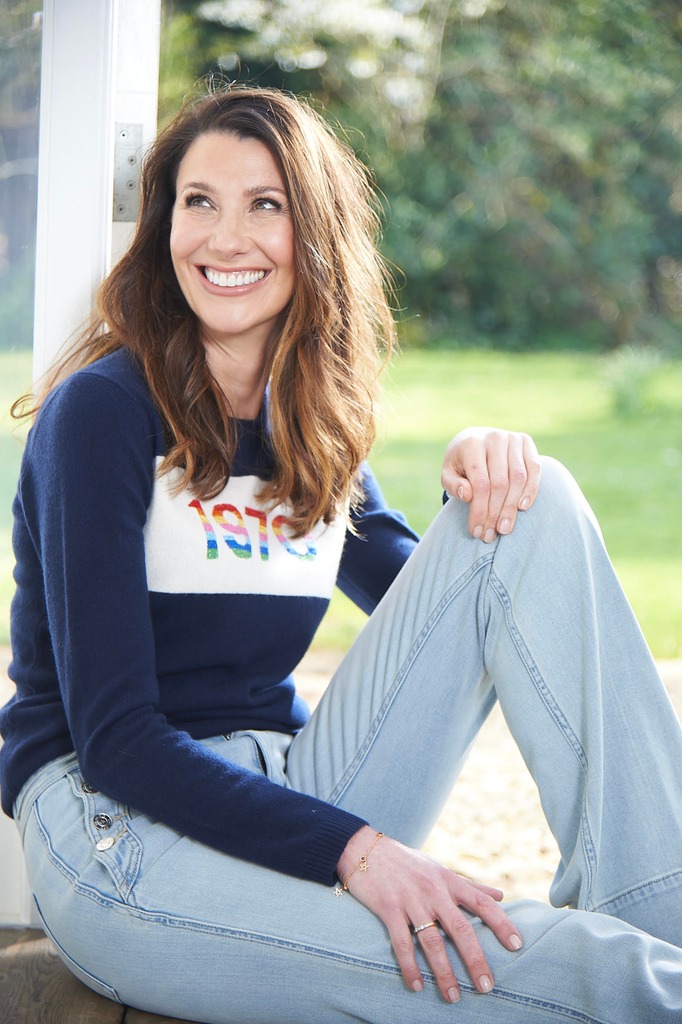 Rosie Green smiling in jeans and jumper