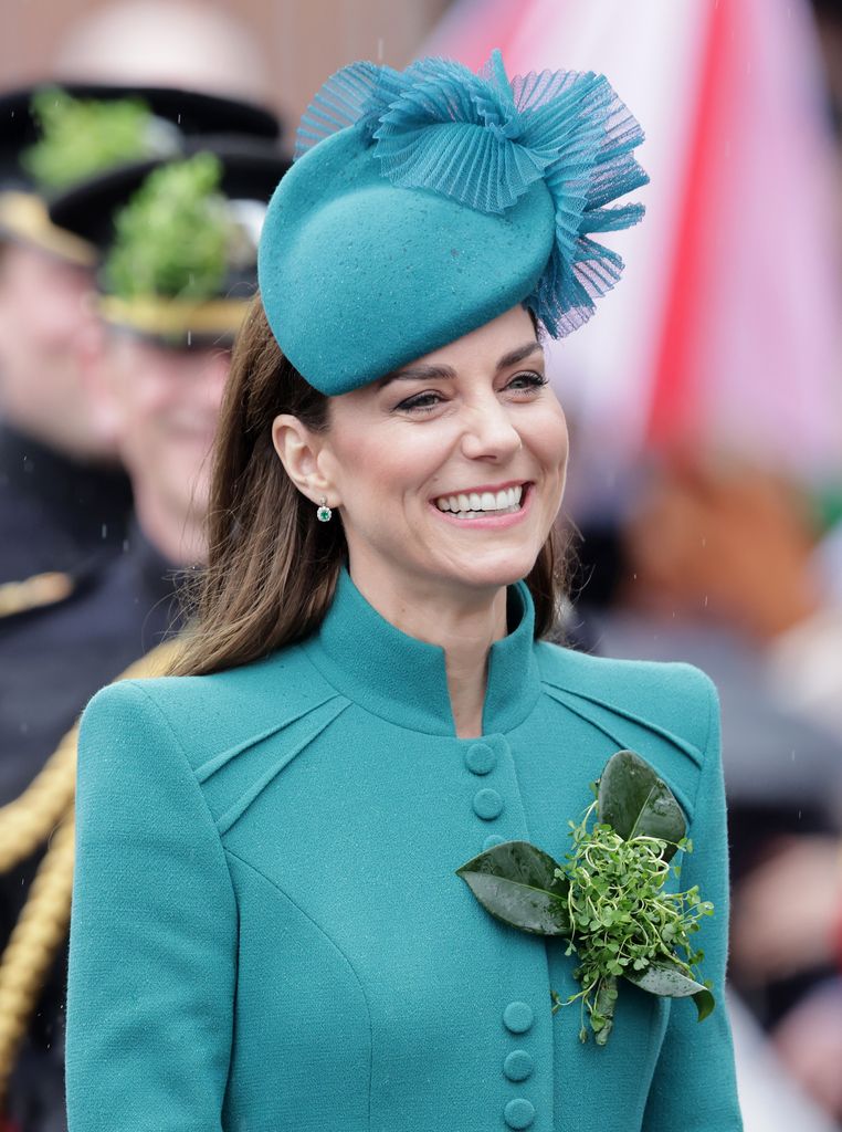 Kate Middleton in a green outfit with shamrock