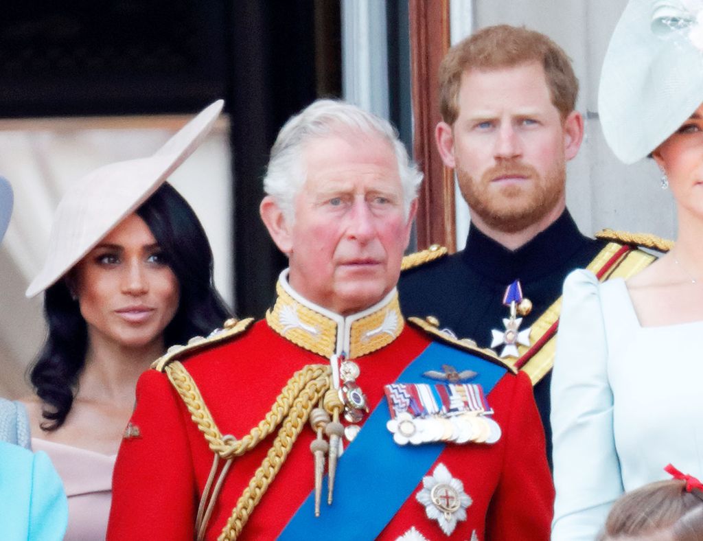 Prince Harry and Meghan Markle with King Charles on balcony