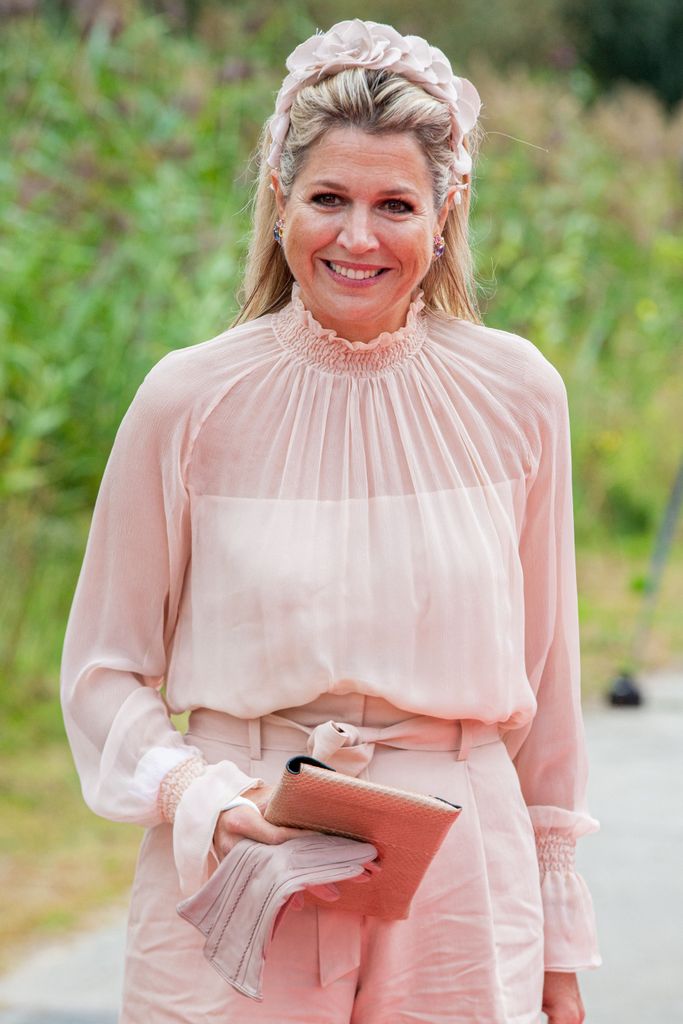 Queen Maxima in a light pink floral band and top
