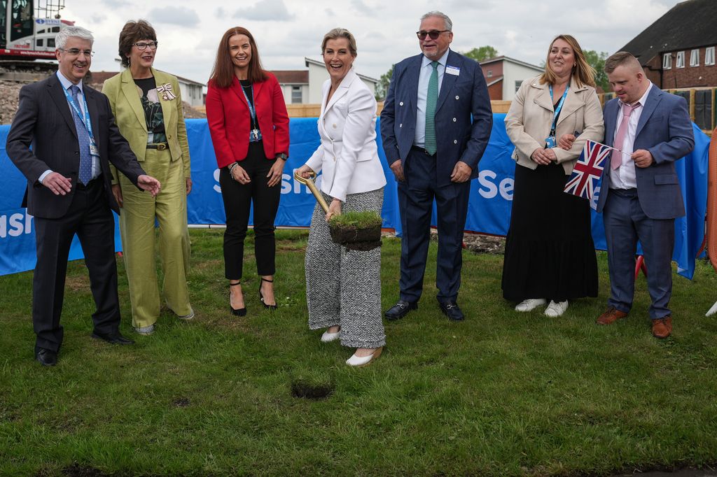 Duchess Sophie digging surrounded by people