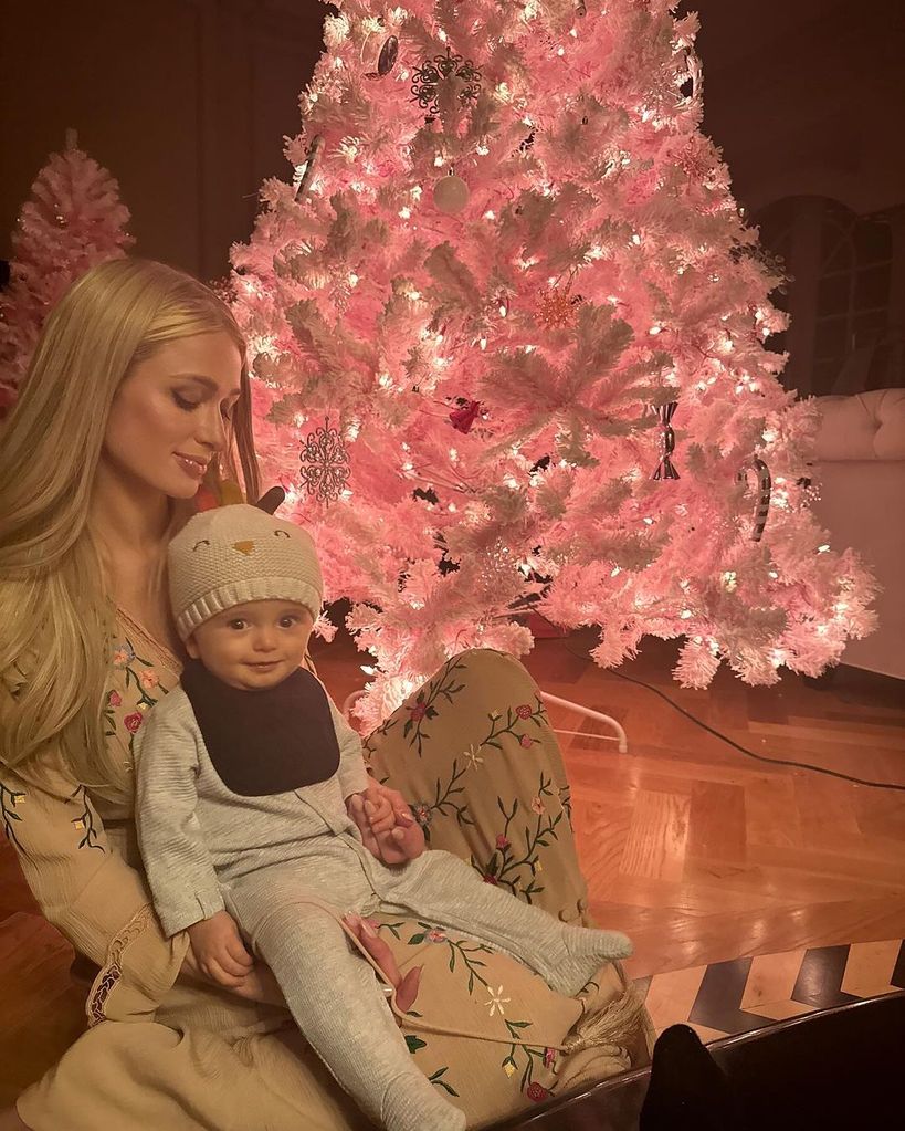 Paris Hilton with baby son Phoenix after getting a new pink Christmas tree to celebrate daughter London's arrival 