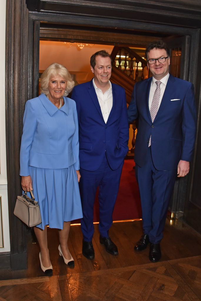 Queen Camilla and son Tom Parker Bowles smiling at fortnum and mason event