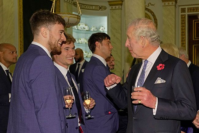 King Charles III meets Olympic medallists, from left, Mathew Lee, Jack Laugher and Tom Daley at Buckingham Palace