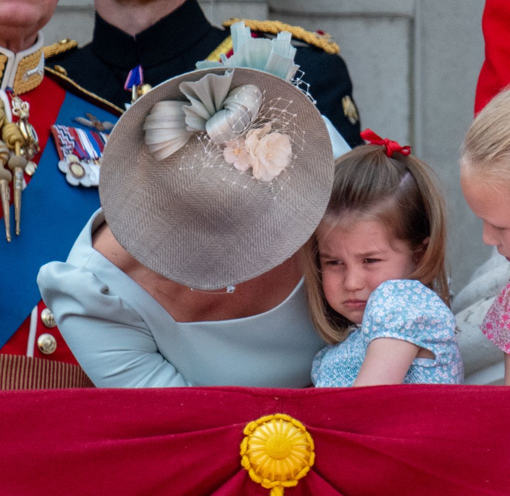 The Princess of Wales comforts her daughter Princess Charlotte