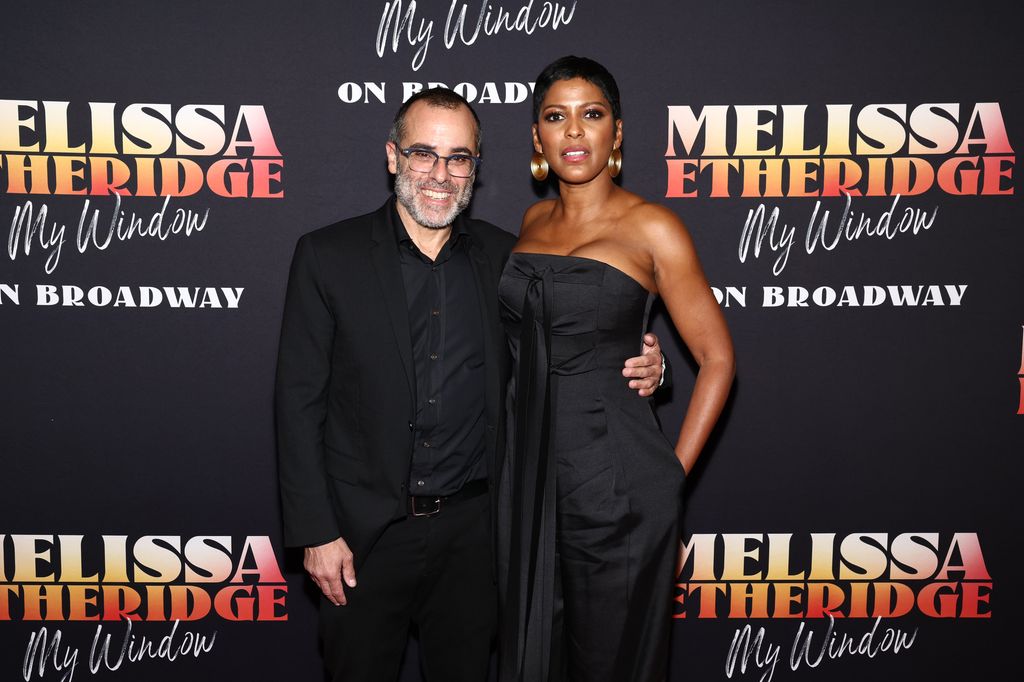 Steven Greener and his wife Tamron Hall pose for the cameras