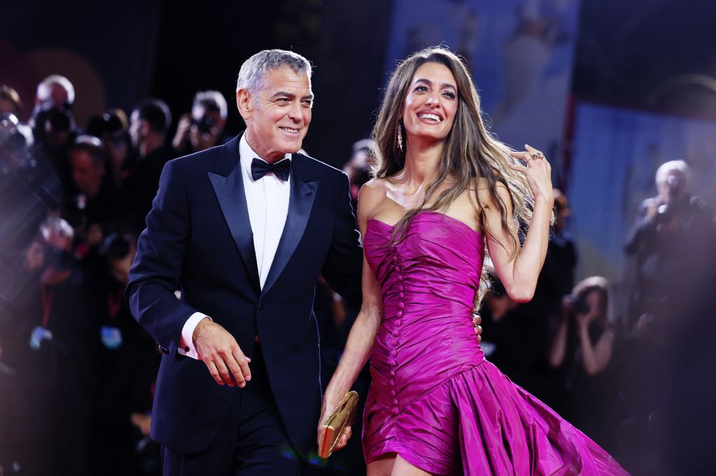 George Clooney and Amal Clooney attend the "Jay Kelly" red carpet during the 82nd Venice International Film Festival on August 28, 2025 in Venice, Italy.