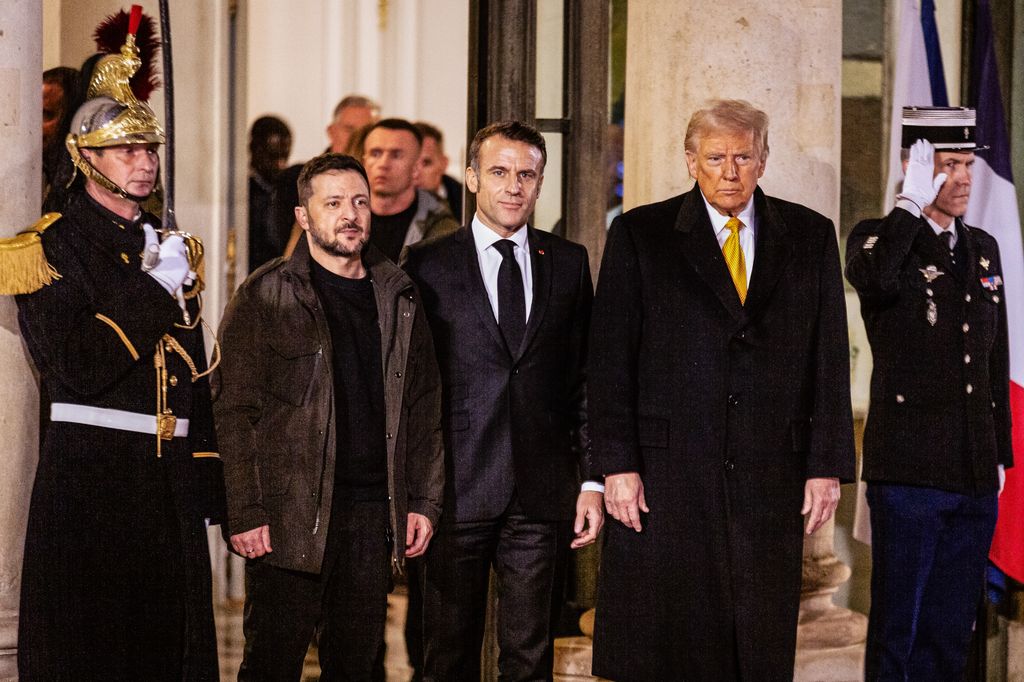 Ukrainian President Volodymyr Zelensky (L) and the newly elected US President Donald Trump (R) leaves the Elysée Palace after they met with the French President Emmanuel Macron