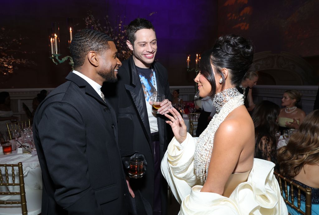 Kim Kardashian and Pete Davidson chatting to Usher