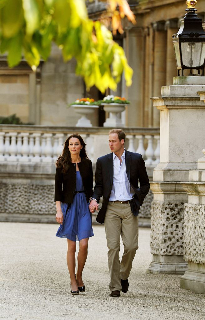Prince William and Catherine, Duchess of Cambridge walk hand in hand from Buckingham Palace