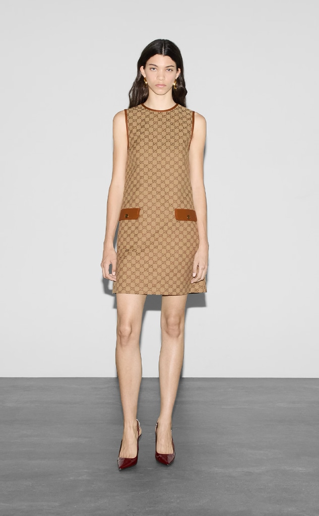 A model poses for the Gucci website in a GG Canvas Dress