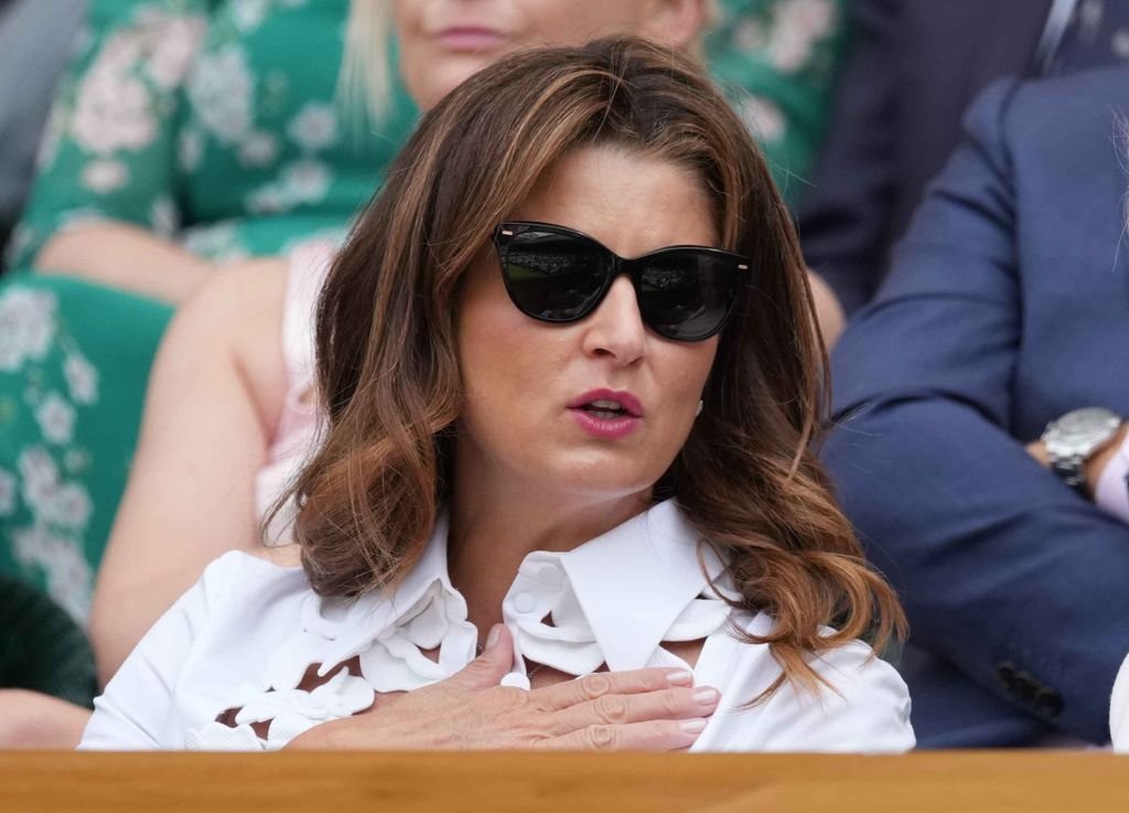 I can't stop thinking about Mirka Federer's white lace dress at
