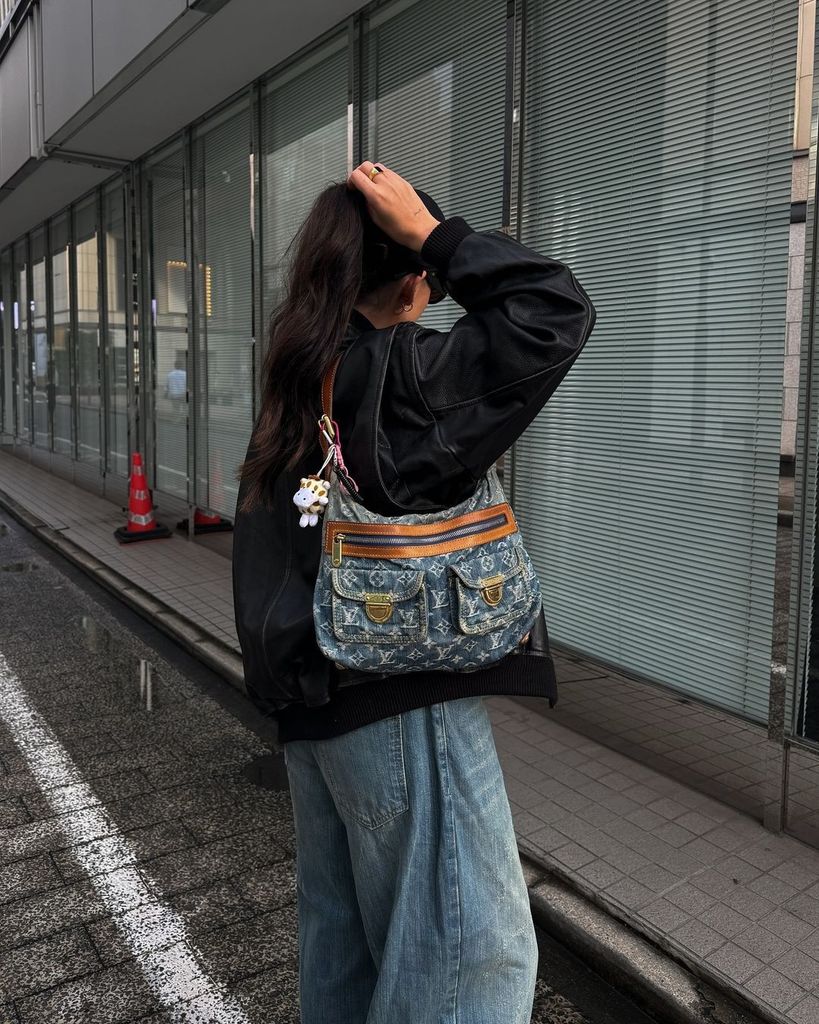 Street style photo of denim handbag