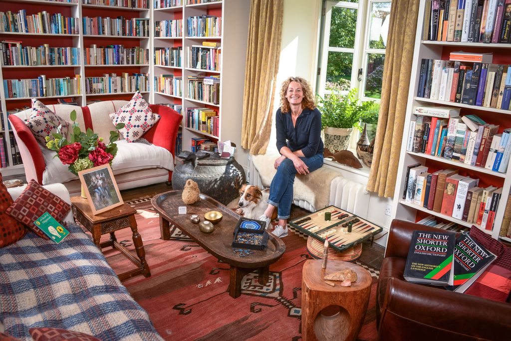 Kate Humble and a dog in a decorated living room