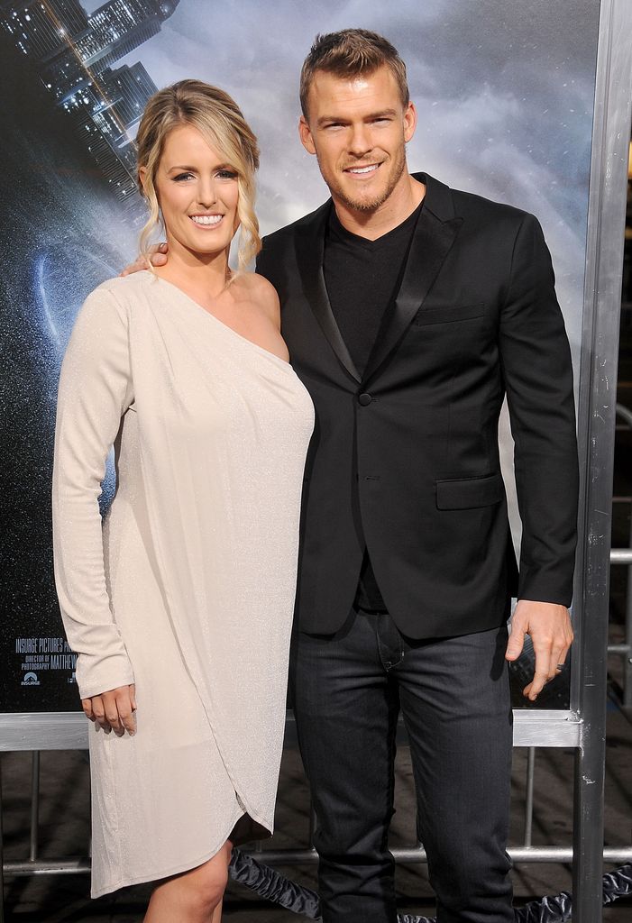 Alan Ritchson and wife Catherine posing red carpet
