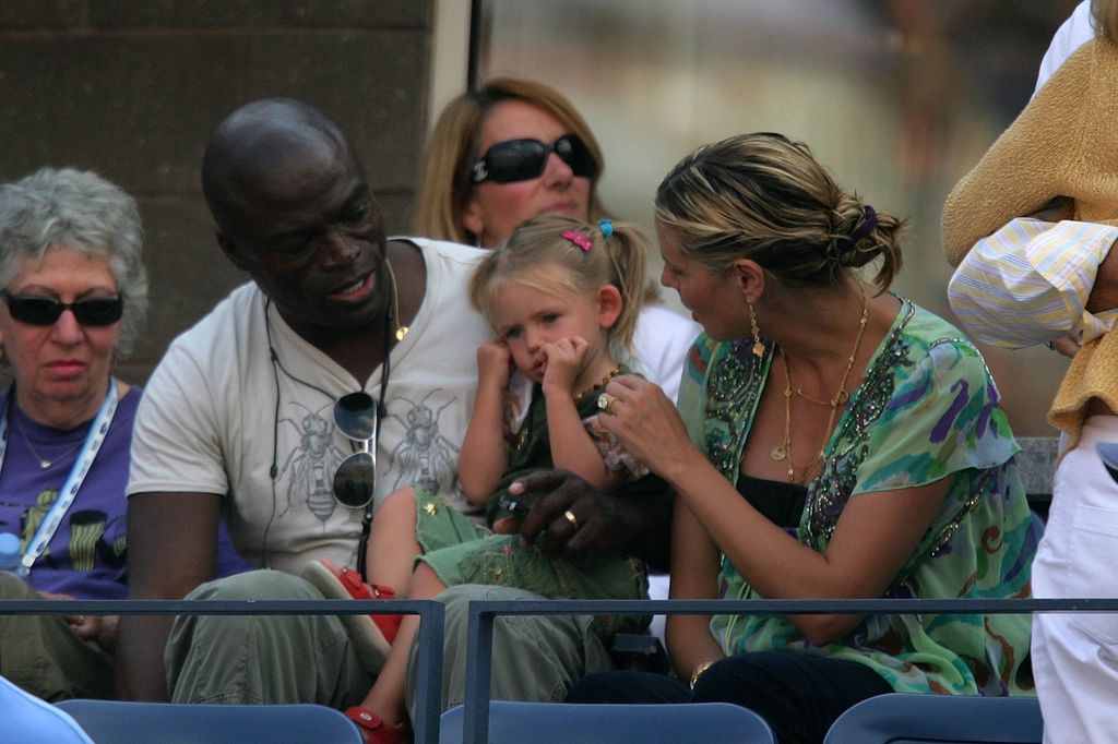 NEW YORK - SEPTEMBER 08:  Singer Seal and Heidi Klum tend to Heidi's daughter, Leni, while watching Amelie Mauresmo of France play Maria Sharapova of Russia in the women's semi-final at the U.S. Open at the USTA Billie Jean King National Tennis Center in Flushing Meadows Corona Park on September 8, 2006 in the Flushing neighborhood of the Queens borough of New York City.  (Photo by Matthew Stockman/Getty Images)