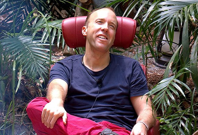 matt hancock sits in leader chair in jungle