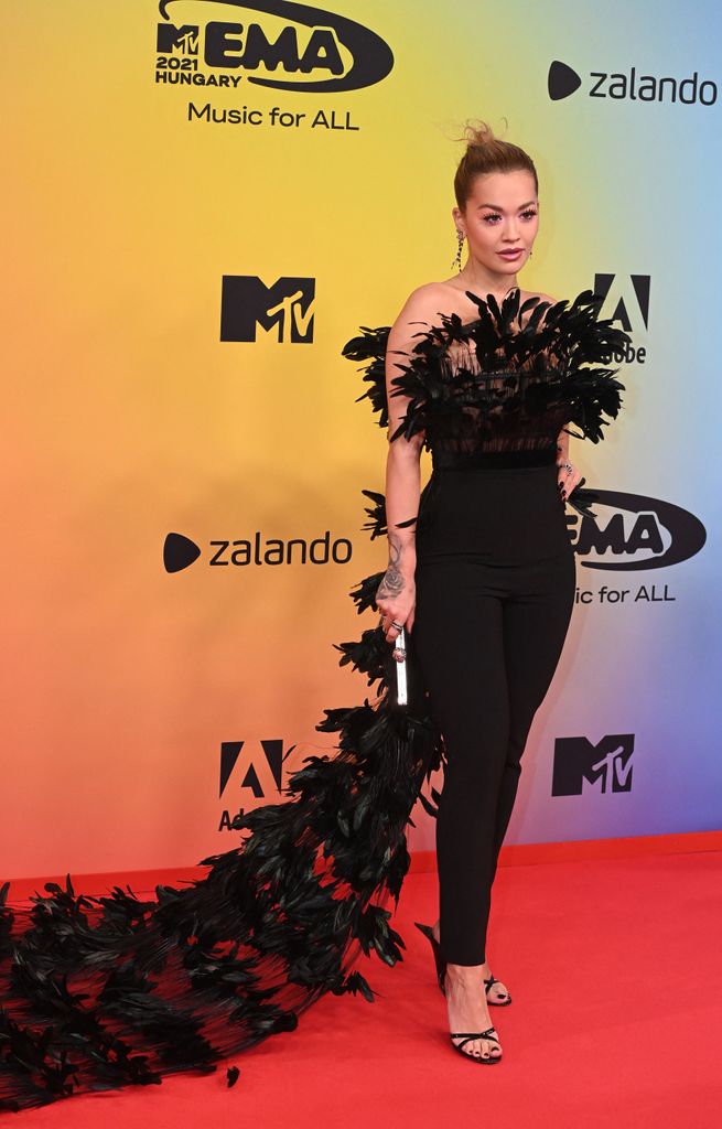 British singer-songwriter Rita Ora poses on the red carpet as she arrives for the MTV Europe Music Awards at the Laszlo Papp Budapest Sports Arena in Budapest, Hungary on November 14, 2021