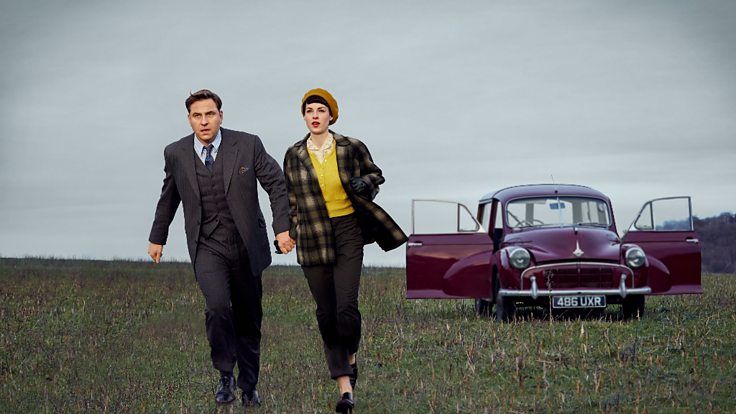 man and woman running in field