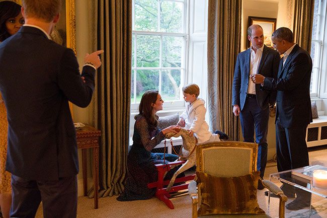 prince george plays on rocking horse with obamas