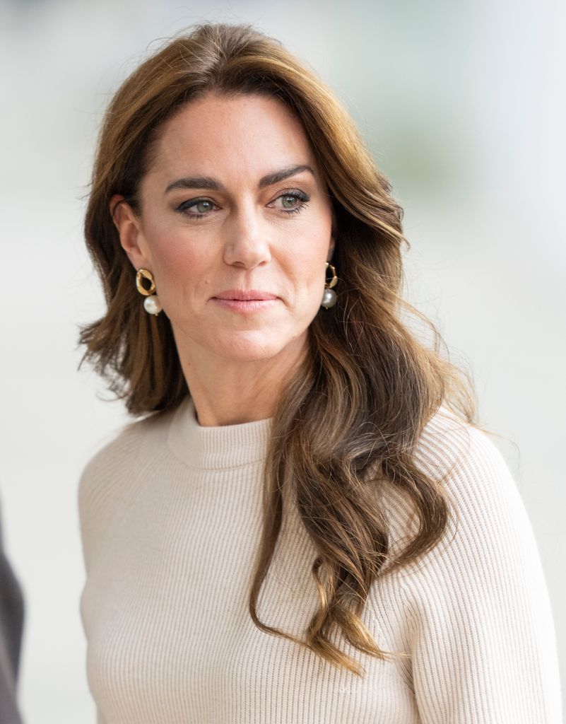 Kate Middleton wearing knitted jumper and pearl earrings