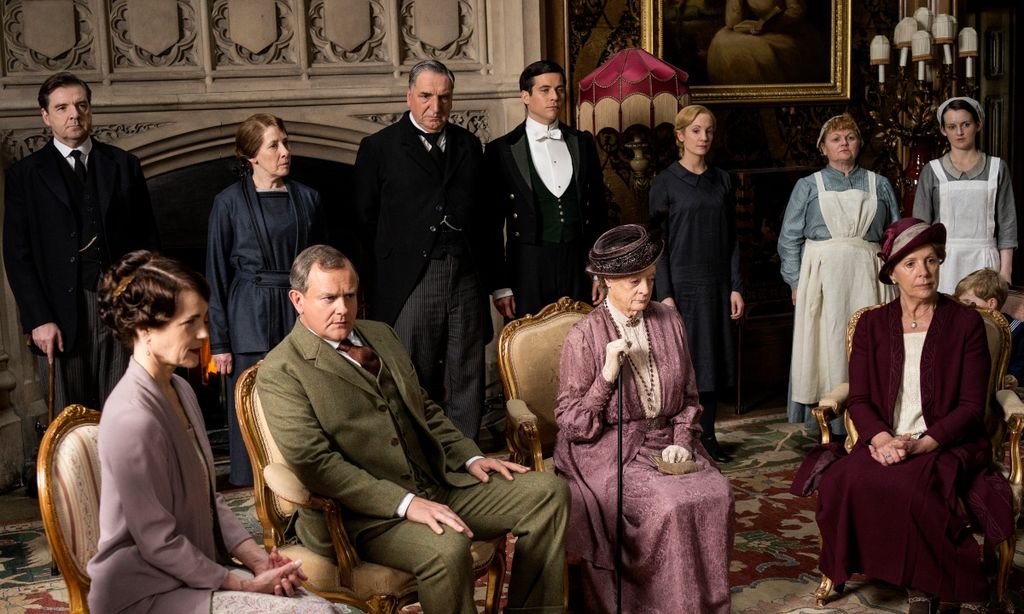 downton abbey cast sit together in room