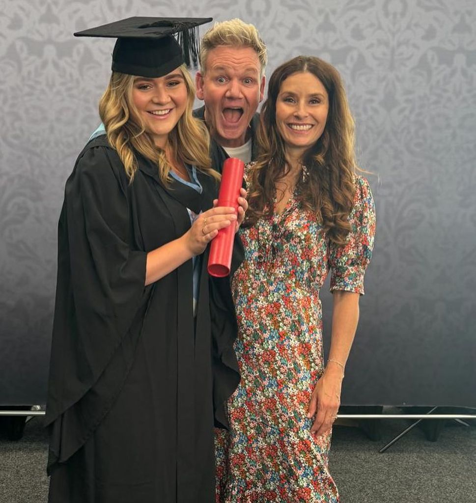 family trio posing for graduation photo