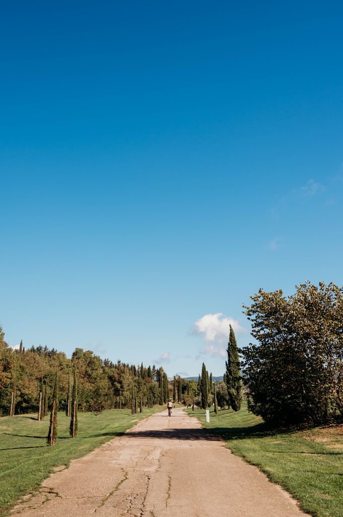 A man riding a bike in Tuscany