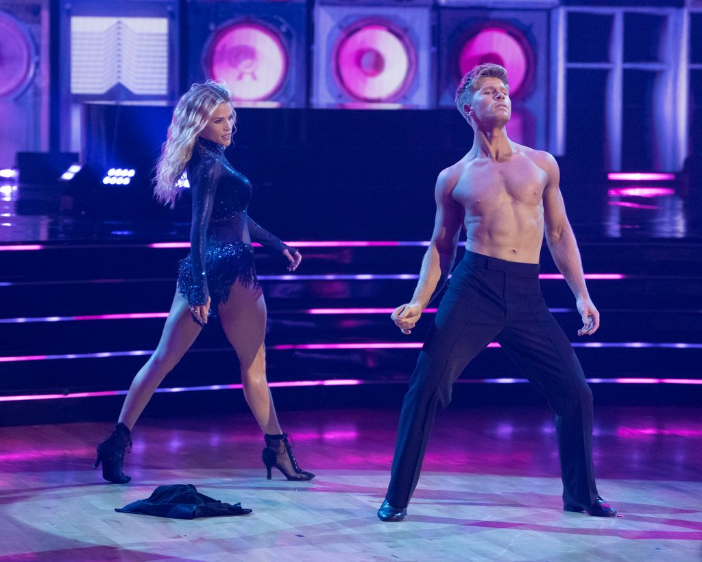Witney Carson dancing with a shirtless Robert Irwin on Dancing with the Stars