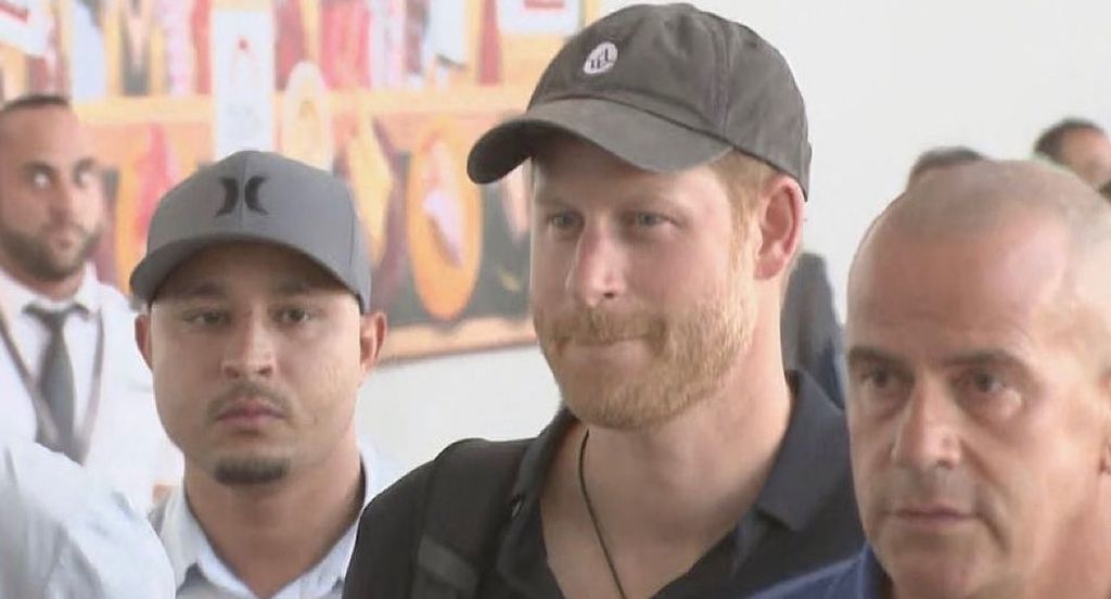 Prince Harry wearing a cap at Tokyo airport