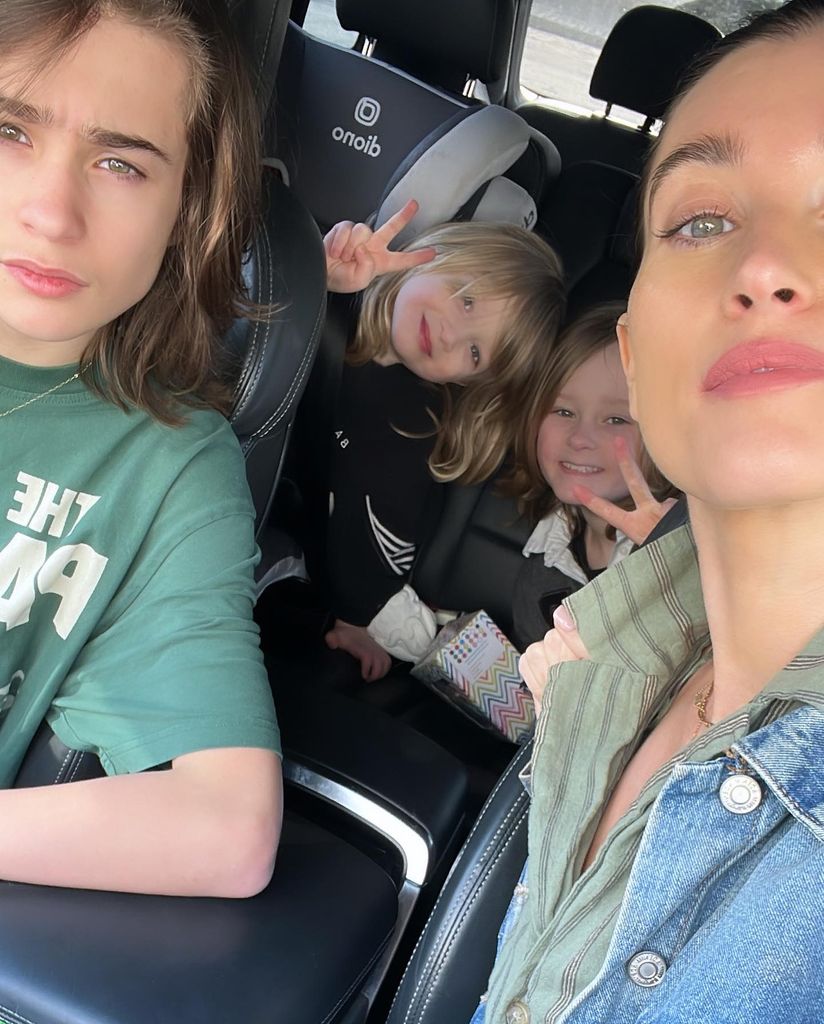 Charley Webb taking car selfie with children Buster, Bowie and Ace 