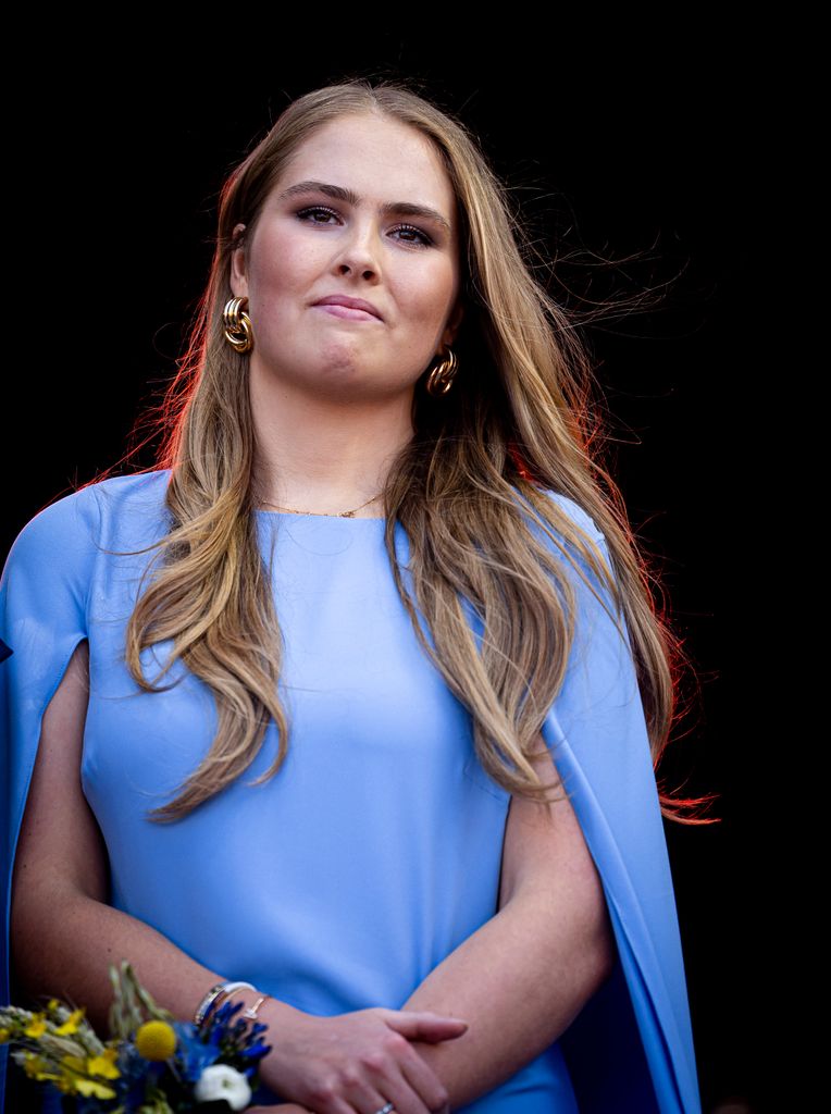 Princess Catharina-Amalia wearing blue caped dress