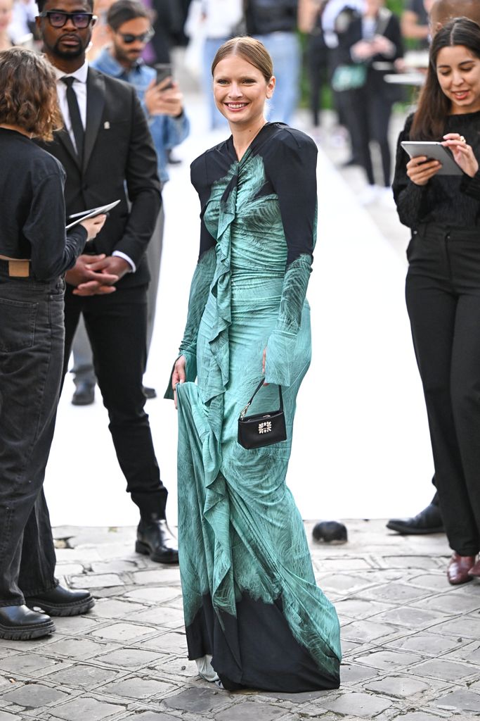 Victoria Beckham dances into Paris Fashion Week