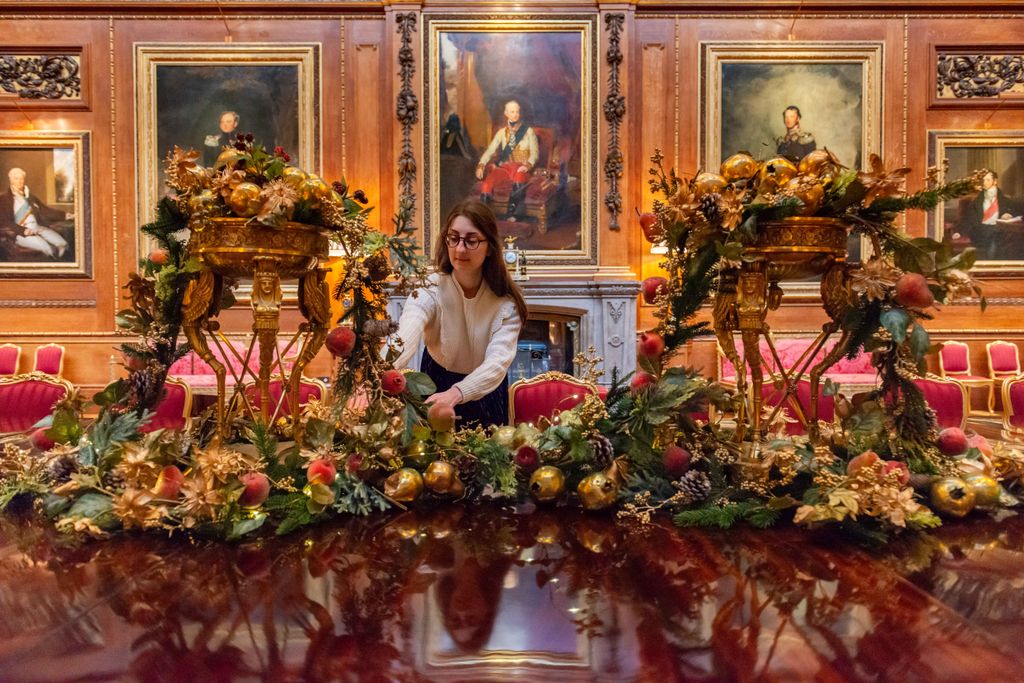 The finishing touches are added to the table display inside the the Waterloo Chamber