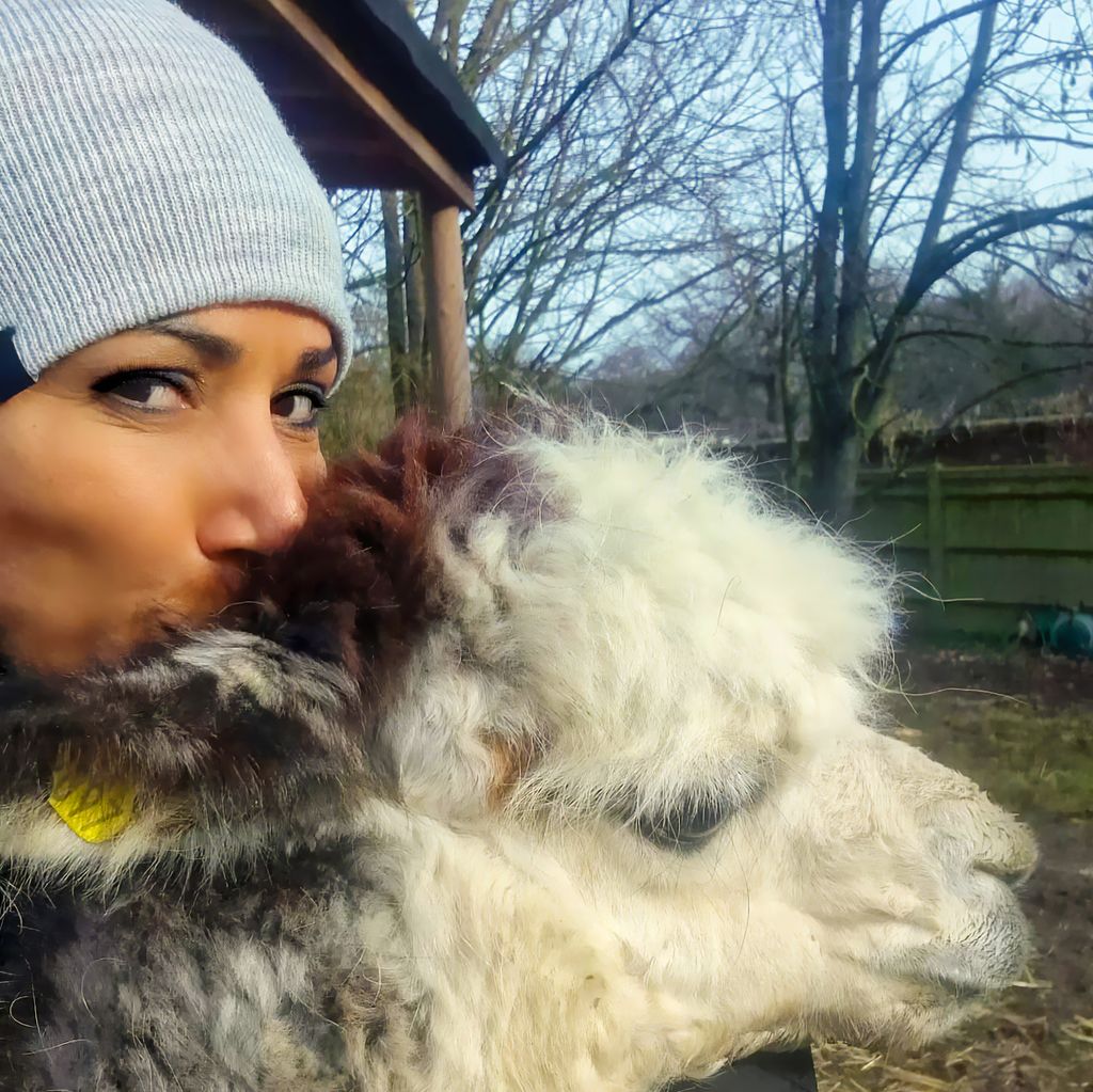 Kelly Holmes poses with her alpacas