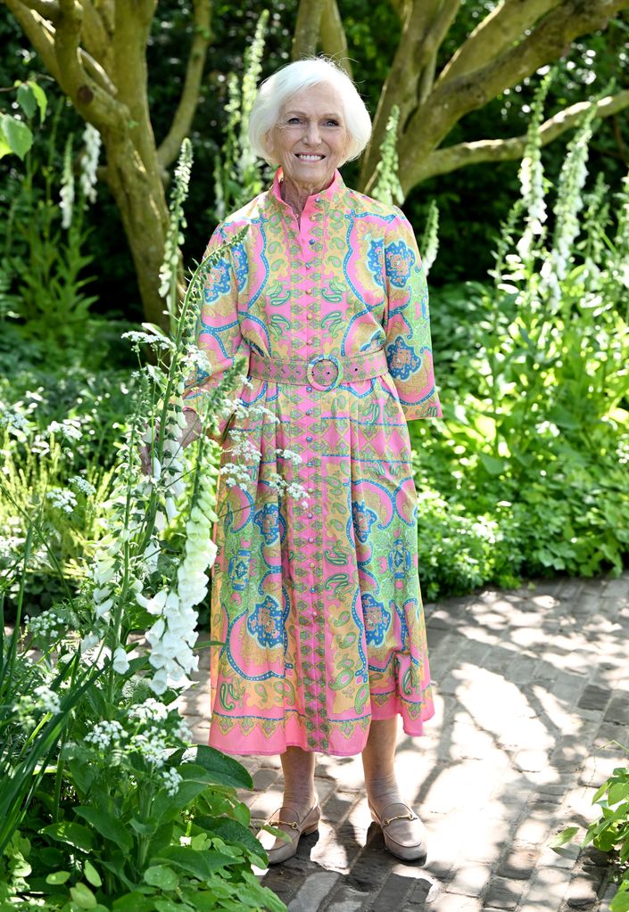 President of the National Garden Scheme Dame Mary Berry attends The RHS Chelsea Flower Show in a multicoloured dress and brown loafers