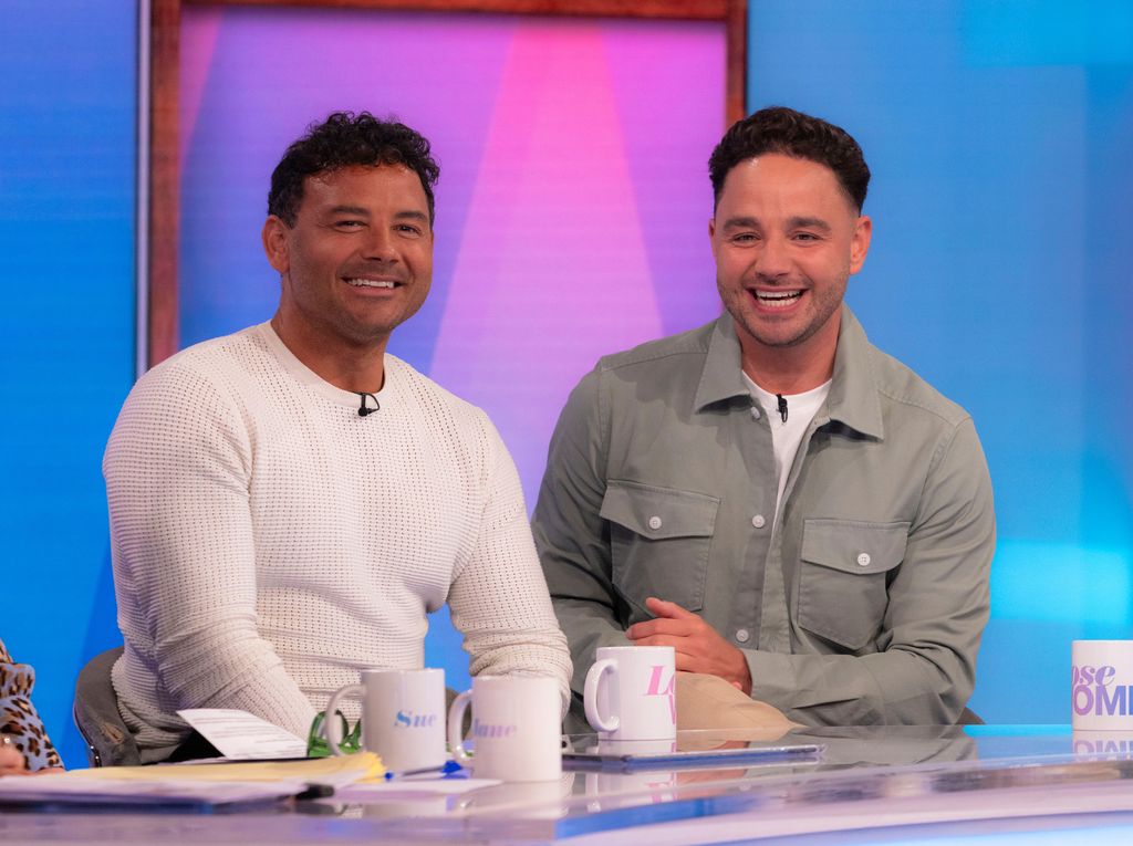 two men smiling at camera