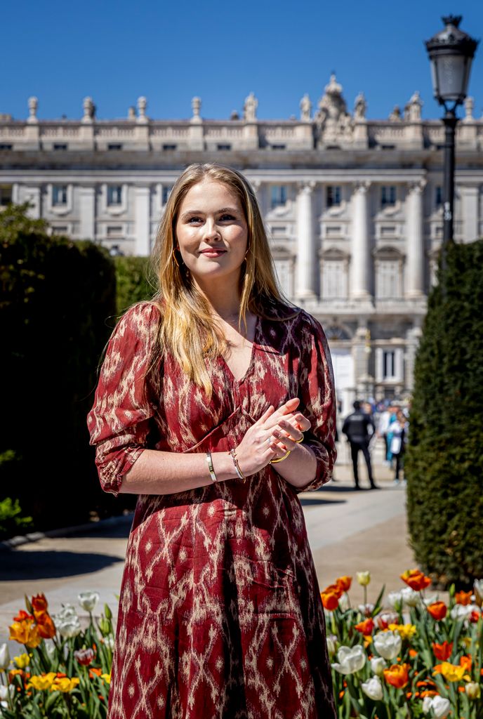princess amalia in red dress smiling 