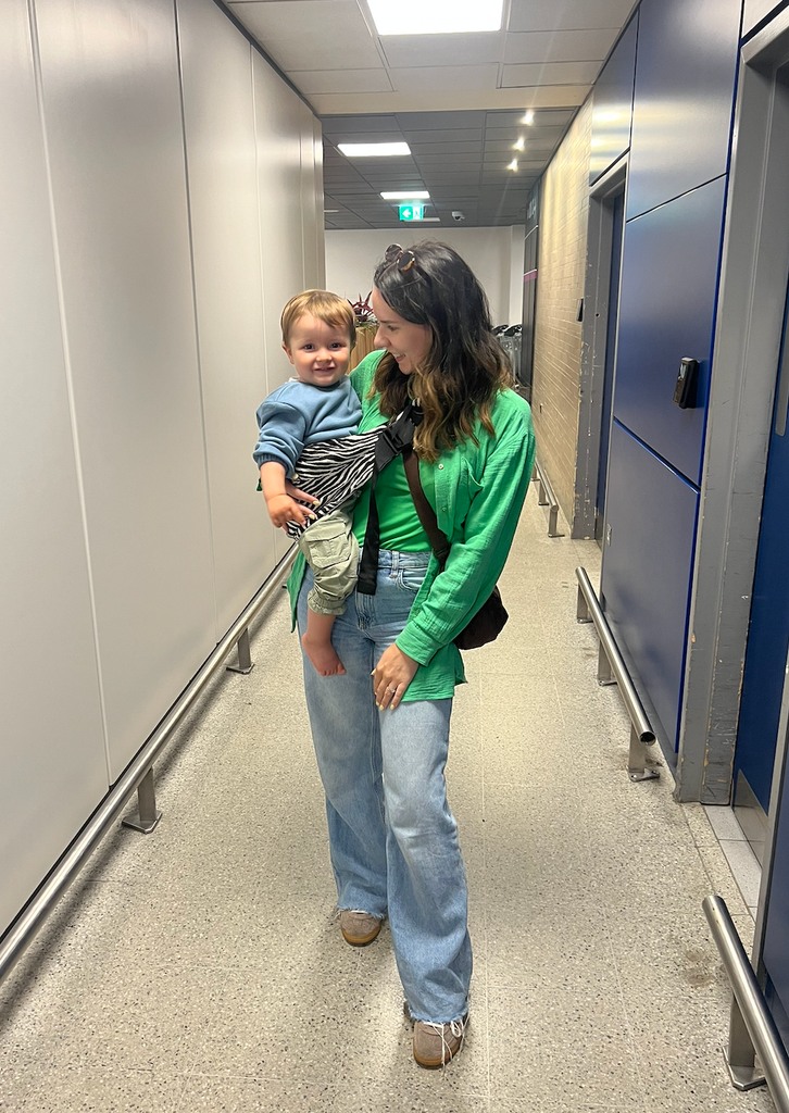 woman with toddler in carrier 