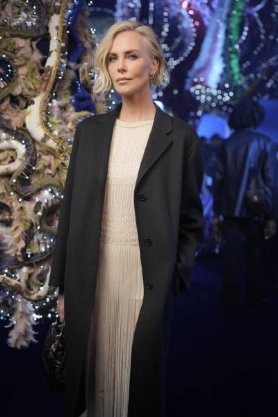 Charlize Theron attending the Dior fashion show during Paris Fashion Week
