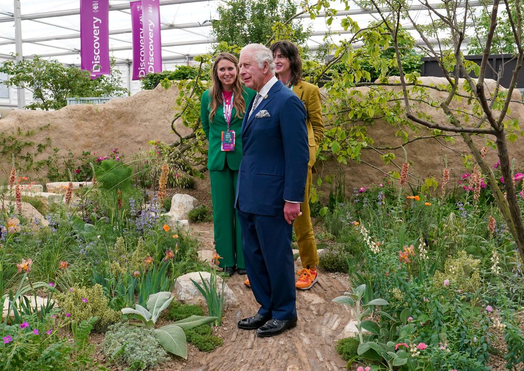 King Charles talks with Josie Maughton (L) and Jane Porter (R) at Chelsea Flower SHow