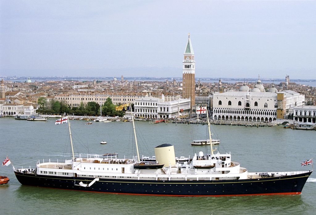 The Royal Yacht Britannia sailing through Venice