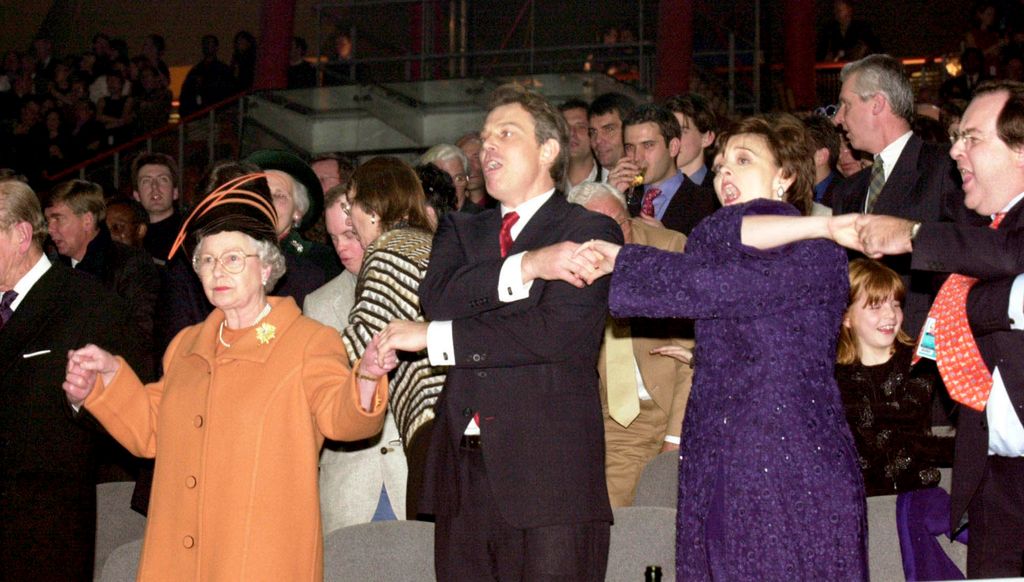 The Queen, Tony Blair, and his wife Cherie Blair during the Millenium New Year celebrations on December 31, 1999 at the Millennium Dome