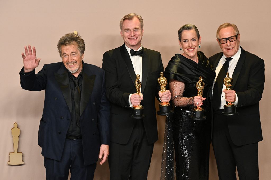 (L-R) US and presenter Actor Al Pacino, British filmmaker Christopher Nolan (also Best Director), British film producer Emma Thomas, and US film producer Charles Roven, pose in the press room with the Oscar for Best Picture for "Oppenheimer" during the 96th Annual Academy Awards at the Dolby Theatre in Hollywood, California on March 10, 2024. (Photo by Robyn BECK / AFP) (Photo by ROBYN BECK/AFP via Getty Images)