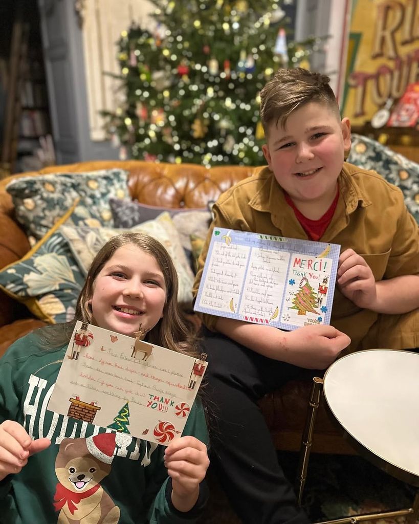 Arthur and Dorothy Strawbridge posed in front of the family Christmas tree