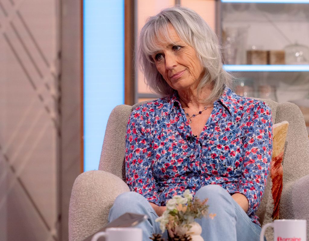 Suzie Fletcher in a floral blouse and jeans