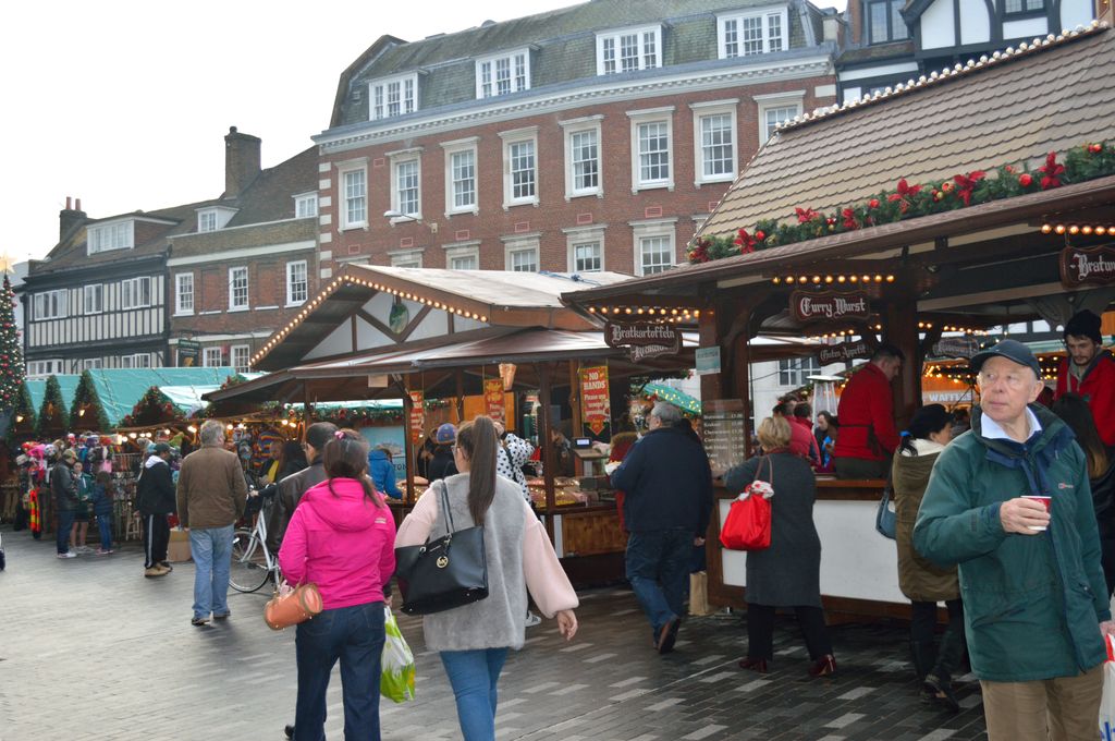 view of people walking through christmas market in kingston upon thames