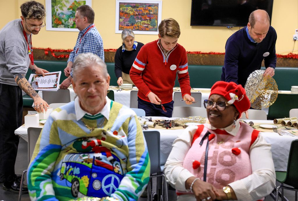 Prince William and Prince George making Christmas decorations